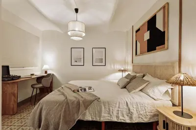 a living room with a couch and a tv at Poblet - 2 bedrooms and balcony in Poblenou in Barcelona