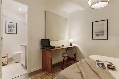 a living room with a couch and a table at Poblet - 2 bedrooms and balcony in Poblenou in Barcelona