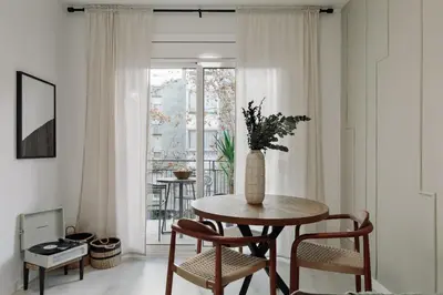 a bedroom with a bed and a table and a desk at Noguera - 2 bedrooms in Eixample Esquerra in Barcelona