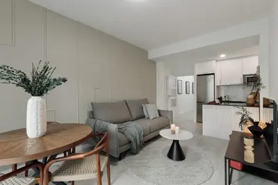 a living room with a couch and a table at Noguera - 2 bedrooms in Eixample Esquerra in Barcelona