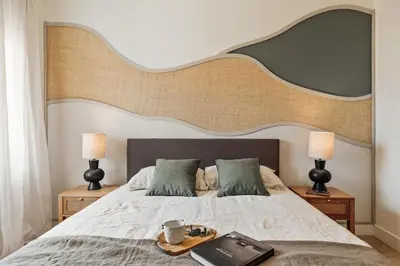 a mirror on a wooden table in a bedroom at Champey - 2 bedrooms and balcony in Sant Gervasi in Barcelona