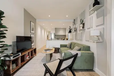 a bedroom with a large bed with a desk and a desk at Champey - 2 bedrooms and balcony in Sant Gervasi in Barcelona