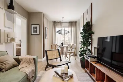 a living room with a couch and a table at Champey - 2 bedrooms and balcony in Sant Gervasi in Barcelona