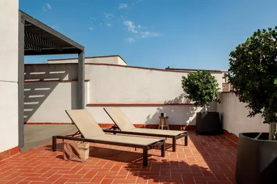 a living room with a couch and a lamp at Annamer - 2 bedrooms and terrace in El Born in Barcelona