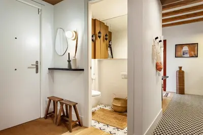 a bedroom with a bed with a brick wall at Annamer - 2 bedrooms and terrace in El Born in Barcelona
