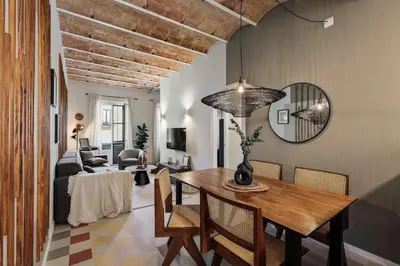 a kitchen with white cabinets and a dishwasher at Paleo - 2 bedrooms and office in Eixample Dreta in Barcelona