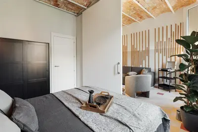a living room with a couch and a table at Paleo - 2 bedrooms and office in Eixample Dreta in Barcelona
