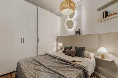 a living room with a couch and a table at Toliman - 1 bedroom and office in Eixample Dreta in Barcelona