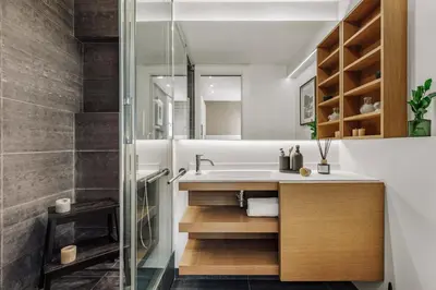 a kitchen with white cabinets and a counter with stools at Toliman - 1 bedroom and office in Eixample Dreta in Barcelona
