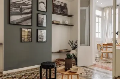 a living room with a tv and a table at Gili - 2 bedrooms and terrace in Eixample Dreta in Barcelona