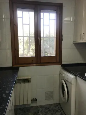a washing machine in a kitchen with a window at Can Bosquet - Casa de invitados adosada a casa familiar in Corbera de Llobregat