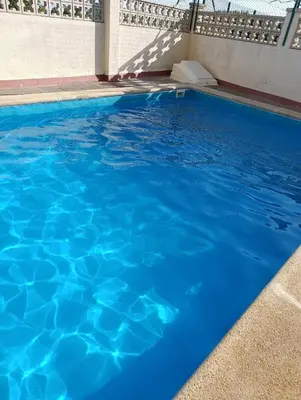 a swimming pool with blue water at Canet playa in Canet de Mar