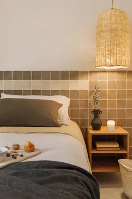 a bedroom with a bed with a tray of food on it at Atalaya - 2 bedrooms in Eixample Esquerra in Barcelona