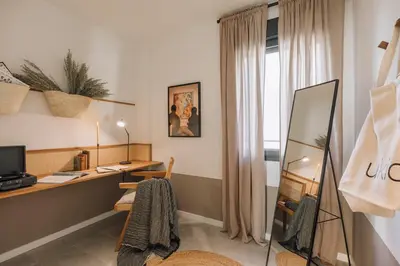 a living room with a couch and a table at Atalaya - 2 bedrooms in Eixample Esquerra in Barcelona