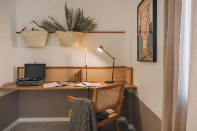 a kitchen and dining room with a table and a stove at Atalaya - 2 bedrooms in Eixample Esquerra in Barcelona