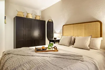 a bedroom with a desk and a bed and a bedroom with a bed at Faya - 1 bedroom and balcony in Gràcia in Barcelona