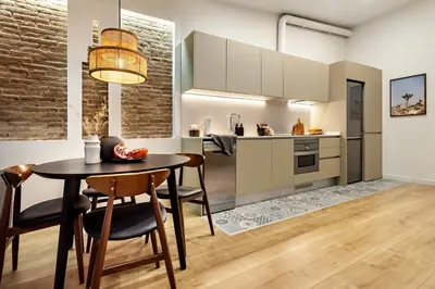 a living room with a couch and a table at Faya - 1 bedroom and balcony in Gràcia in Barcelona