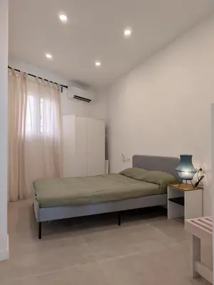 a bedroom with a large bed in a room at Cal Ticó, 6 guests Monistrol de Montserrat in Monistrol