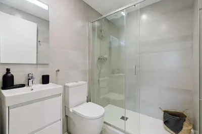 a wooden desk with a mirror and a chair at Piano - 2 bedrooms and terrace in Ciutat Vella in Barcelona