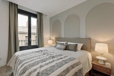a kitchen and dining room with a table and chairs at Piano - 2 bedrooms and terrace in Ciutat Vella in Barcelona