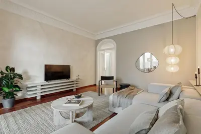 a living room with a couch and a tv at Priorat - 4 bedrooms and office in Sant Gervasi in Barcelona