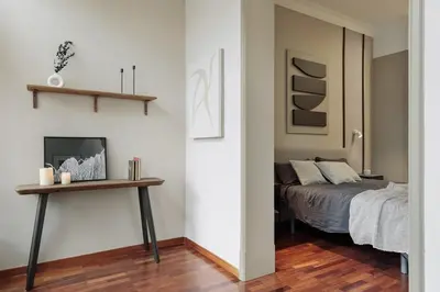 a bedroom with a large bed and a pendant light at Priorat - 4 bedrooms and office in Sant Gervasi in Barcelona