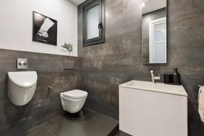 a living room with a couch and a mirror at Priorat - 4 bedrooms and office in Sant Gervasi in Barcelona