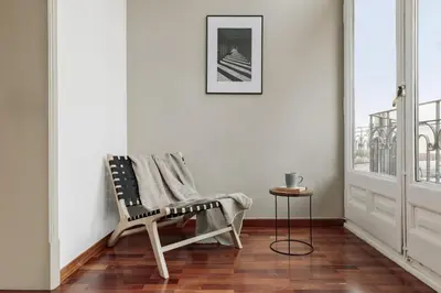 a dining room with a table and a couch at Priorat - 4 bedrooms and office in Sant Gervasi in Barcelona