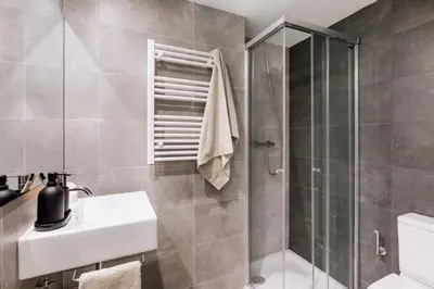 a living room with a couch and a table at Vacar - 3 bedrooms in Eixample Esquerra in Barcelona