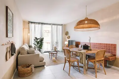 a living room with a table and a couch at Algaba - 2 bedrooms in Eixample Esquerra in Barcelona