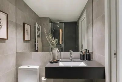 a bathroom with a shower and a toilet and a sink at Algaba - 2 bedrooms in Eixample Esquerra in Barcelona