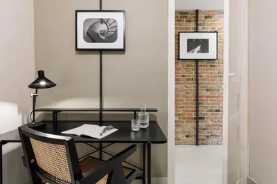 a living room with a couch and a table at Judd - 3 bedrooms and balcony in Eixample Esquerra in Barcelona
