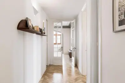a dining room with a table and chairs at Atrani - 3 bedroom in Eixample Dreta in Barcelona