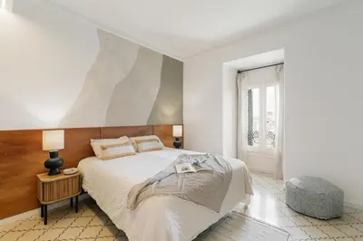 a living room with a couch and a table at Atrani - 3 bedroom in Eixample Dreta in Barcelona