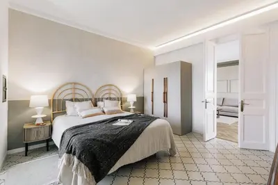 a white bathroom with a sink and a toilet at Atrani - 3 bedroom in Eixample Dreta in Barcelona