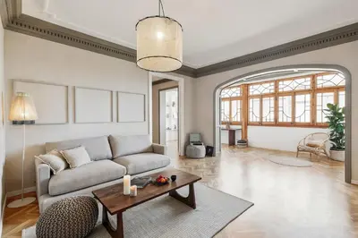 a living room with a couch and a table at Atrani - 3 bedroom in Eixample Dreta in Barcelona