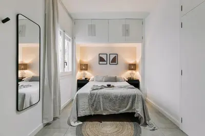 a dining room with a wooden table and chairs at Delfino - 4 bedrooms in Sant Gervasi in Barcelona