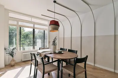 a living room with a couch and a plant at Delfino - 4 bedrooms in Sant Gervasi in Barcelona