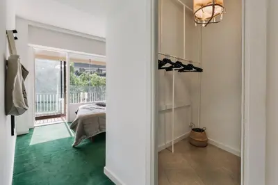 a bedroom with a large bed with a large mirror at Delfino - 4 bedrooms in Sant Gervasi in Barcelona