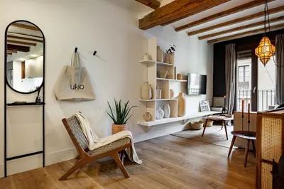 a kitchen with a table and chairs in a kitchen at Anfa - 2 bedrooms in El Born in Barcelona