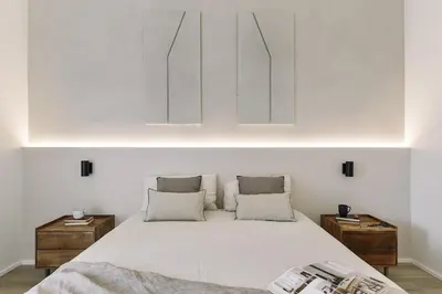 a kitchen with a counter and two stools at Grotta - 3 bedrooms in Sant Gervasi in Barcelona