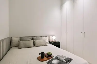 a white hallway with white walls and windows at Grotta - 3 bedrooms in Sant Gervasi in Barcelona