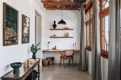 a living room with a couch and a chandelier at Balai - 2 bedrooms in Eixample Dreta in Barcelona