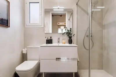 a bathroom with a toilet sink and a shower at Balai - 2 bedrooms in Eixample Dreta in Barcelona