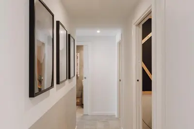 a kitchen with a dining room table with chairs at Aneto - 3 bedrooms in Eixample Esquerra in Barcelona