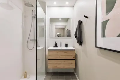 a kitchen with white cabinets and a dishwasher at Andy - 2 bedrooms and office and balcony in Eixample Dreta in Barcelona