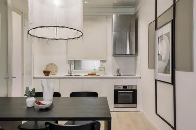 a living room with a couch and a tv at Warhol - 2 bedrooms and balcony in Sant Gervasy in Barcelona