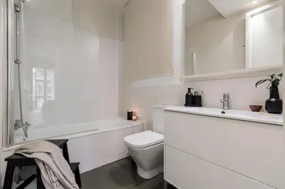 a bedroom with a large bed with two books on it at Warhol - 2 bedrooms and balcony in Sant Gervasy in Barcelona