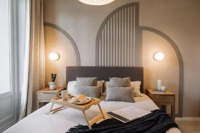 a kitchen with white cabinets and a dishwasher at Senahu - 2 bedrooms and office in Eixample Dreta in Barcelona