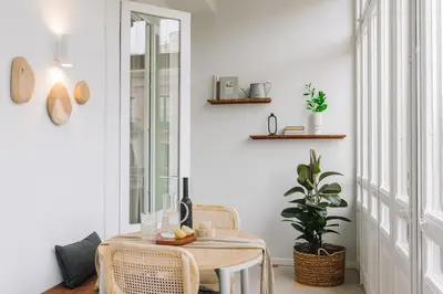 a large building with trees in front of it at Senahu - 2 bedrooms and office in Eixample Dreta in Barcelona